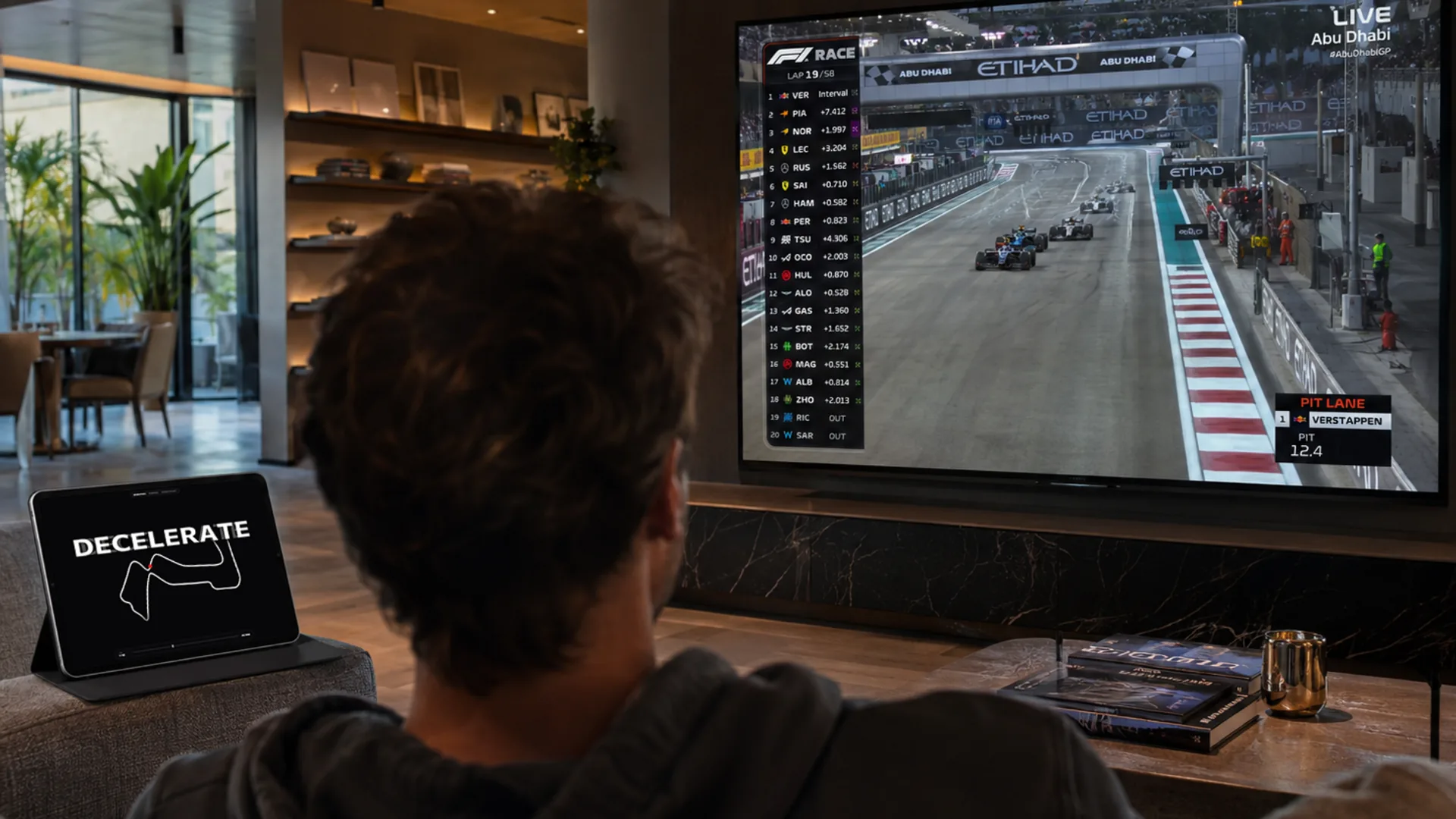 TypeTelemetry reactive typography on a living room TV during a Formula 1 race broadcast